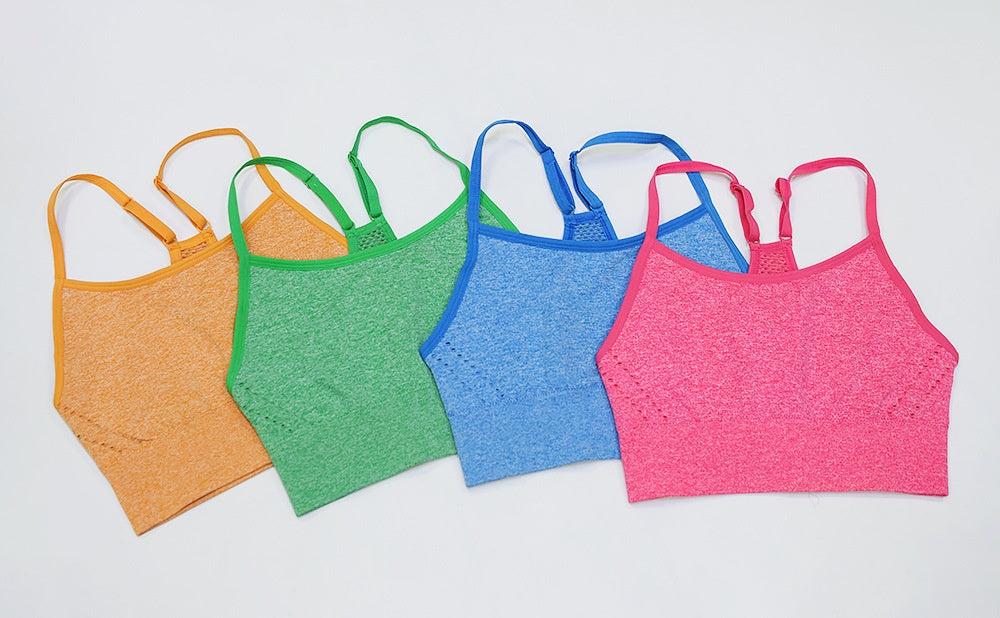Assorted yoga vest sports underwear women in pink, blue, green, and orange, designed for breathable support and stylish activewear.