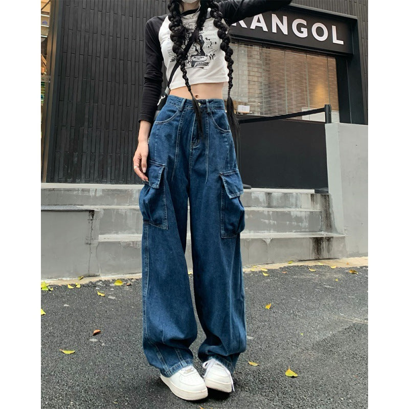Women's fashionable loose wide-leg denim pants featuring cargo pockets, paired with a cropped tee and white sneakers for a trendy urban look.