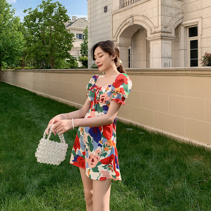 Womens summer puff sleeve square neck dress in floral print, styled for comfort and charm in warm weather.