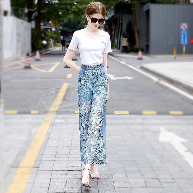 Patchwork denim draping pants for women styled with a white tee, featuring floral lace overlay and wide-leg fit for casual streetwear.