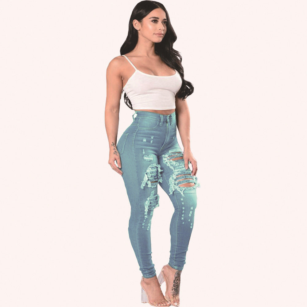 Light blue ripped jeans for women skinny pants with high waist and distressed front, styled for a trendy streetwear look.