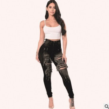 High-waisted black ripped jeans for women skinny pants featuring distressed flair and tight fit, ideal for stylish streetwear.