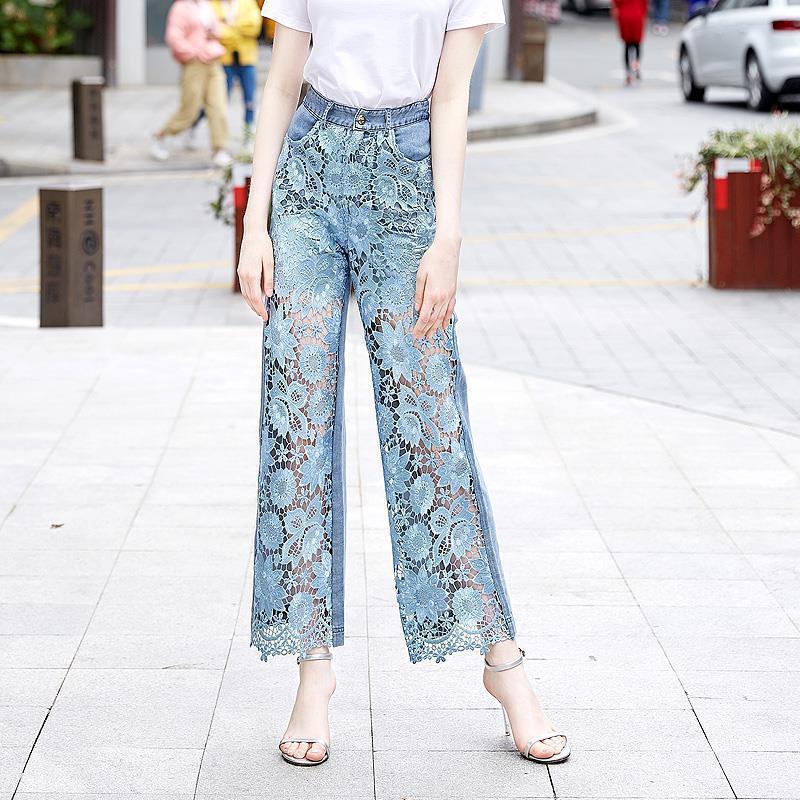 High-waisted patchwork denim draping pants for women with sheer floral lace design, ideal for trendy and creative casual outfits.