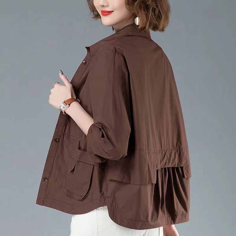 Dark brown wind coat tops for women thin short coat with back pleats and utility pockets, designed for casual and breezy days.