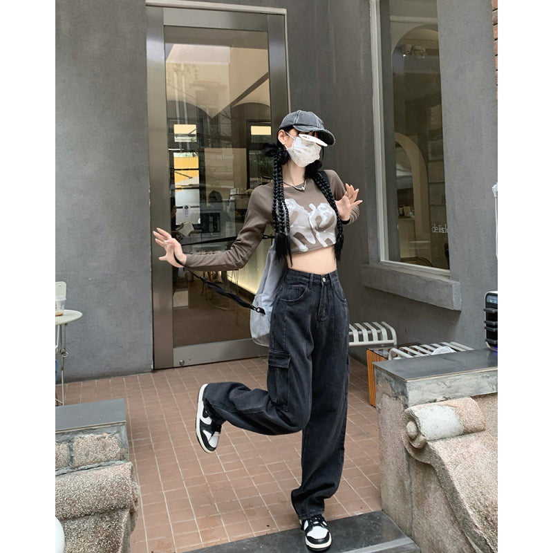 Black wide-leg cargo pants for women styled with a brown crop top and sneakers, perfect for a relaxed and fashionable streetwear outfit.