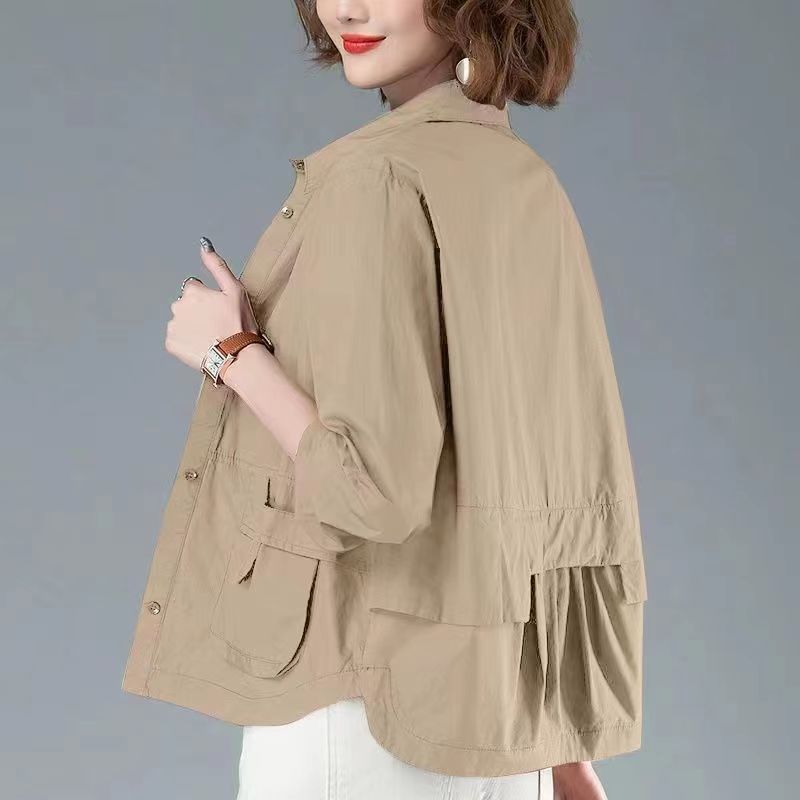 Beige wind coat tops for women thin short coat with flap pockets and relaxed fit, stylish lightweight jacket for all-season wear.