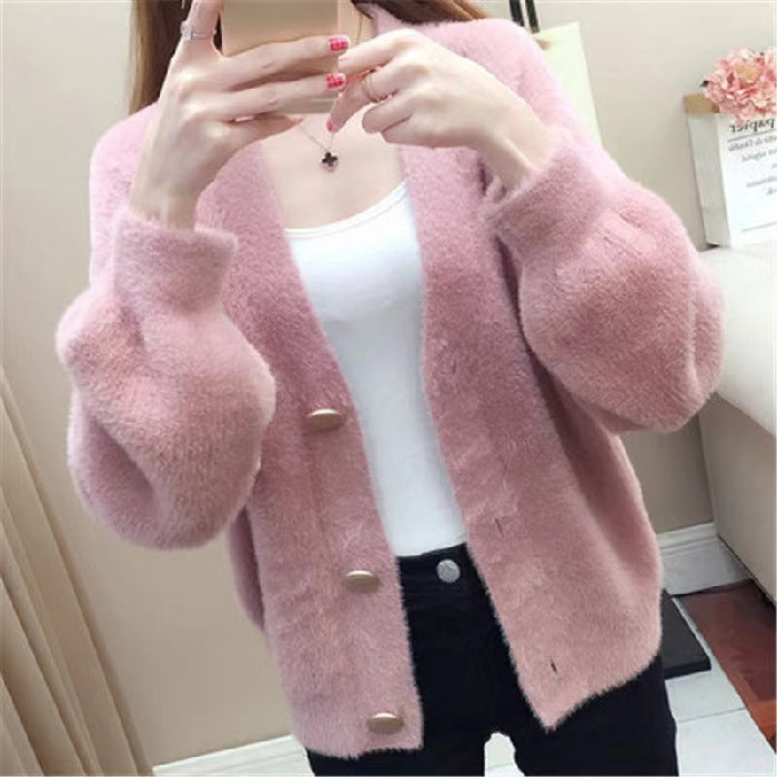 Fashionable knitted short loose outer top for women in blush pink, featuring a relaxed silhouette and button-down front for versatile styling.