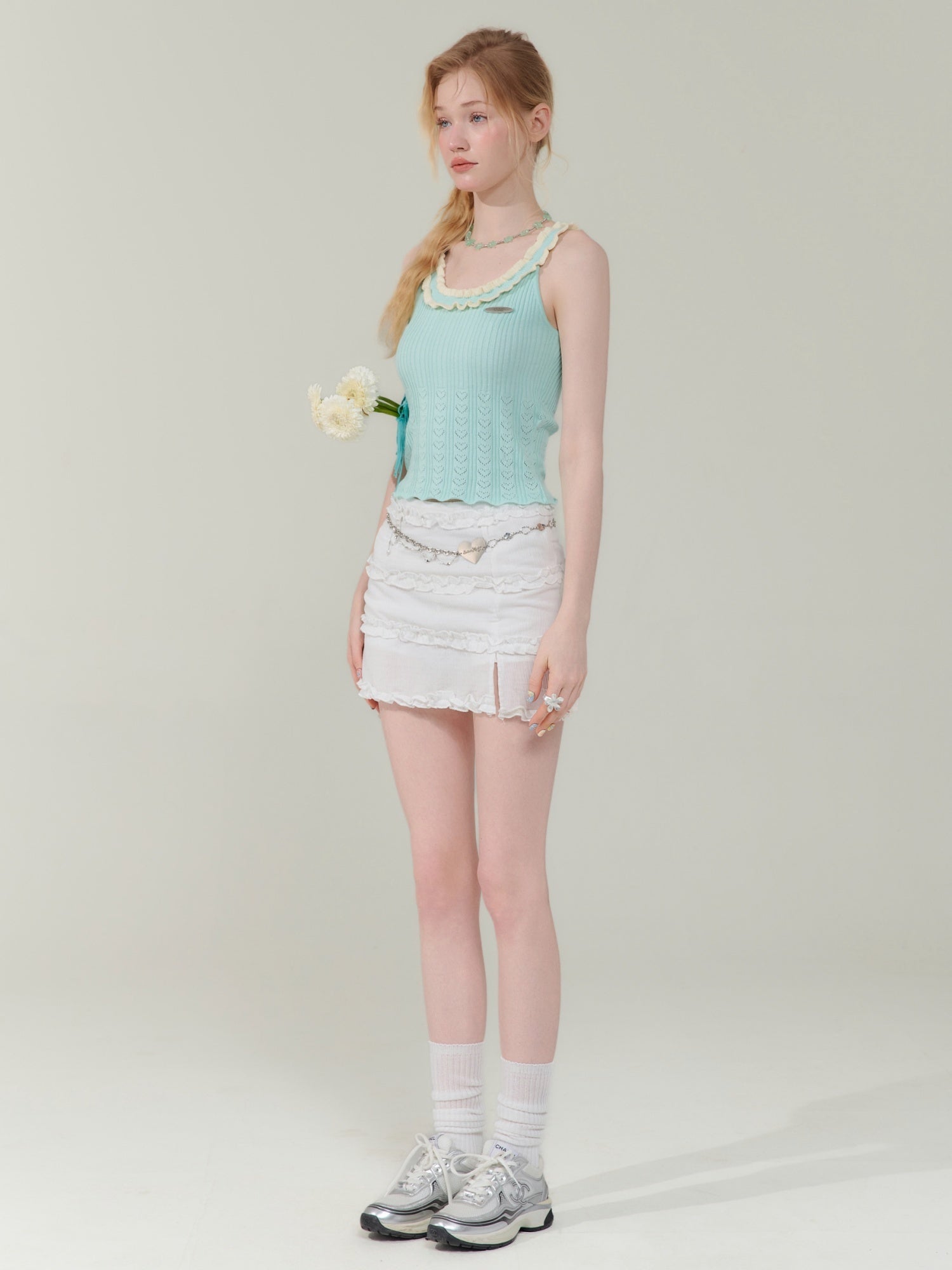 Model wearing retro hip-wrapped skirt for women paired with mint green top, showcasing a chic and feminine outfit for ladies only.