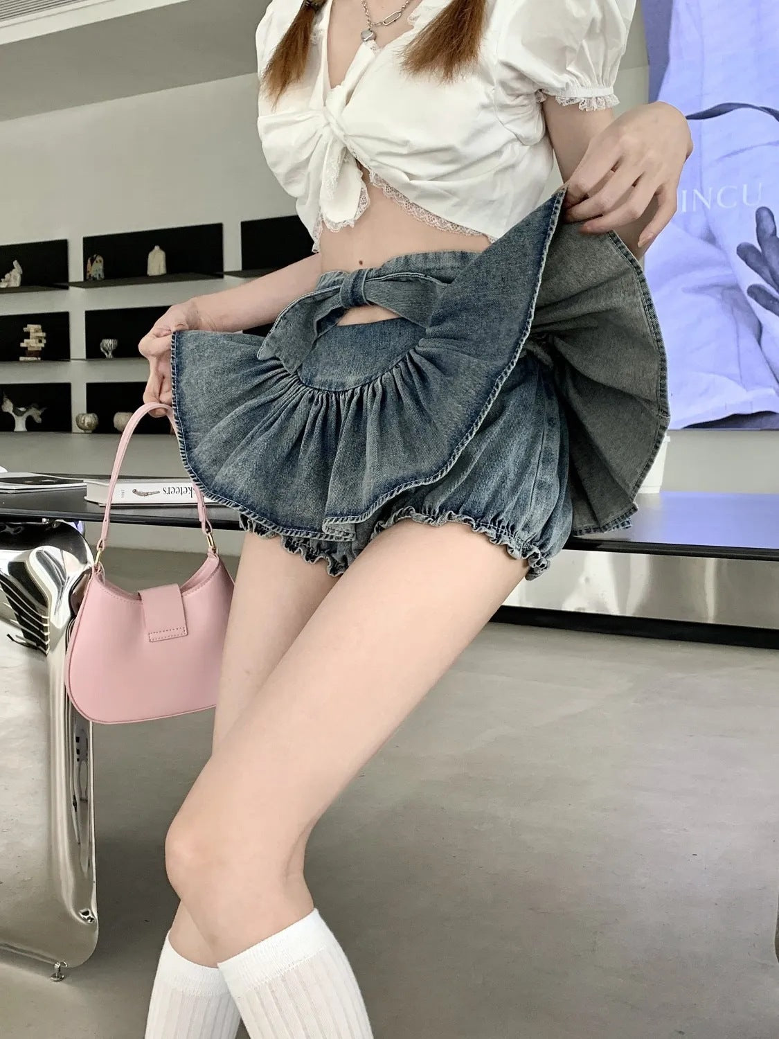 Trendy Butterfly Denim Skirt For Women with a high-waisted fit and flared mini design, ideal for youthful and stylish outfits.