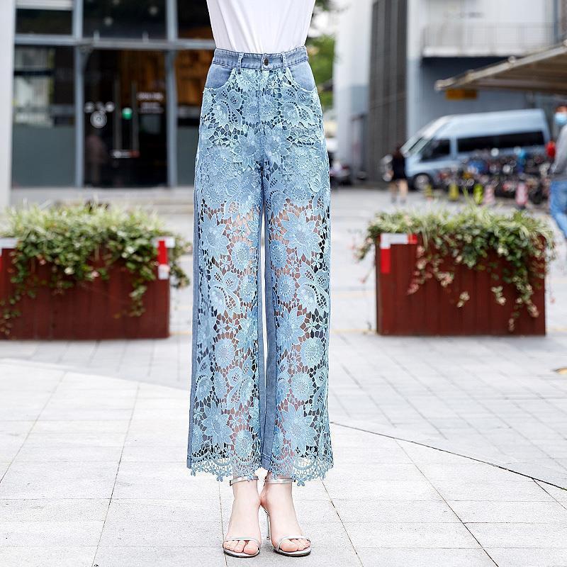 Front view of patchwork denim draping pants for women showcasing intricate lace detailing and relaxed wide-leg silhouette.